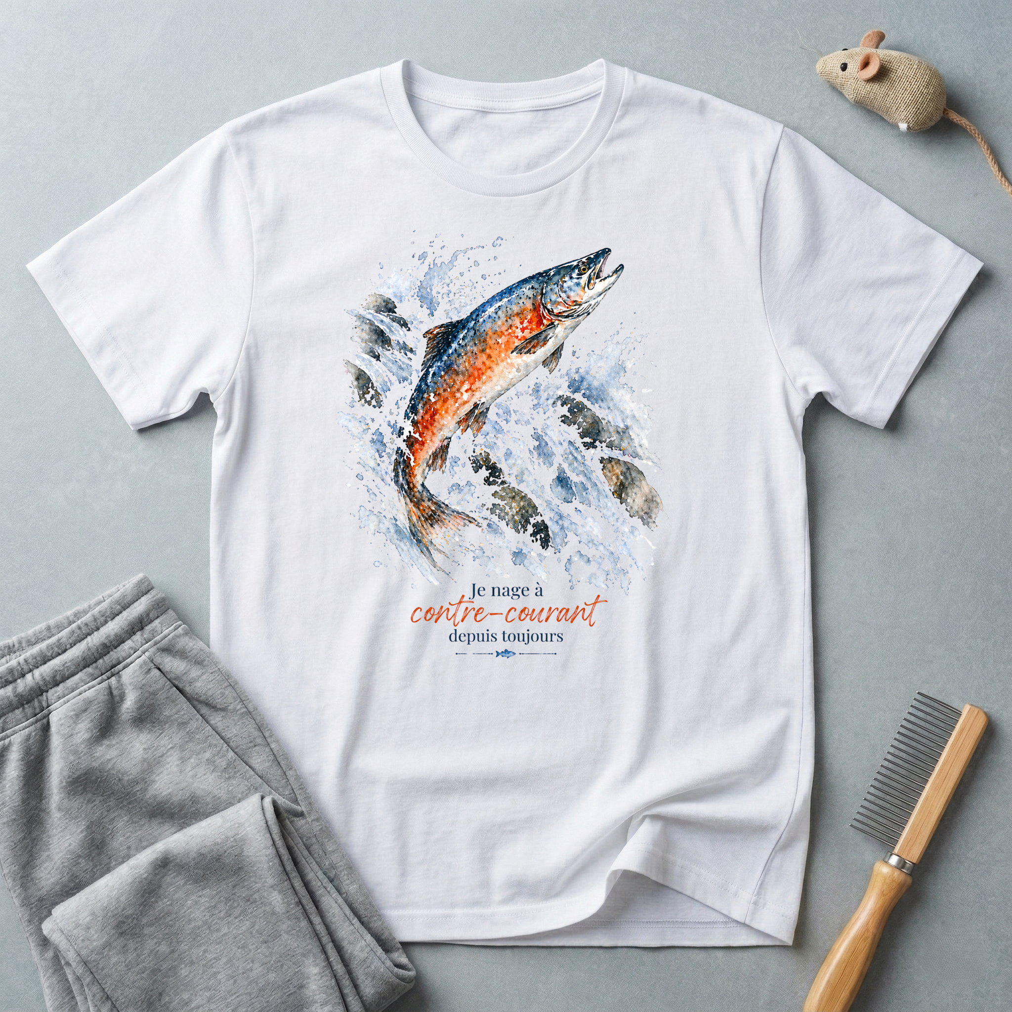 T-shirt graphique saumon bondissant — "Je nage à contre-courant depuis toujours."