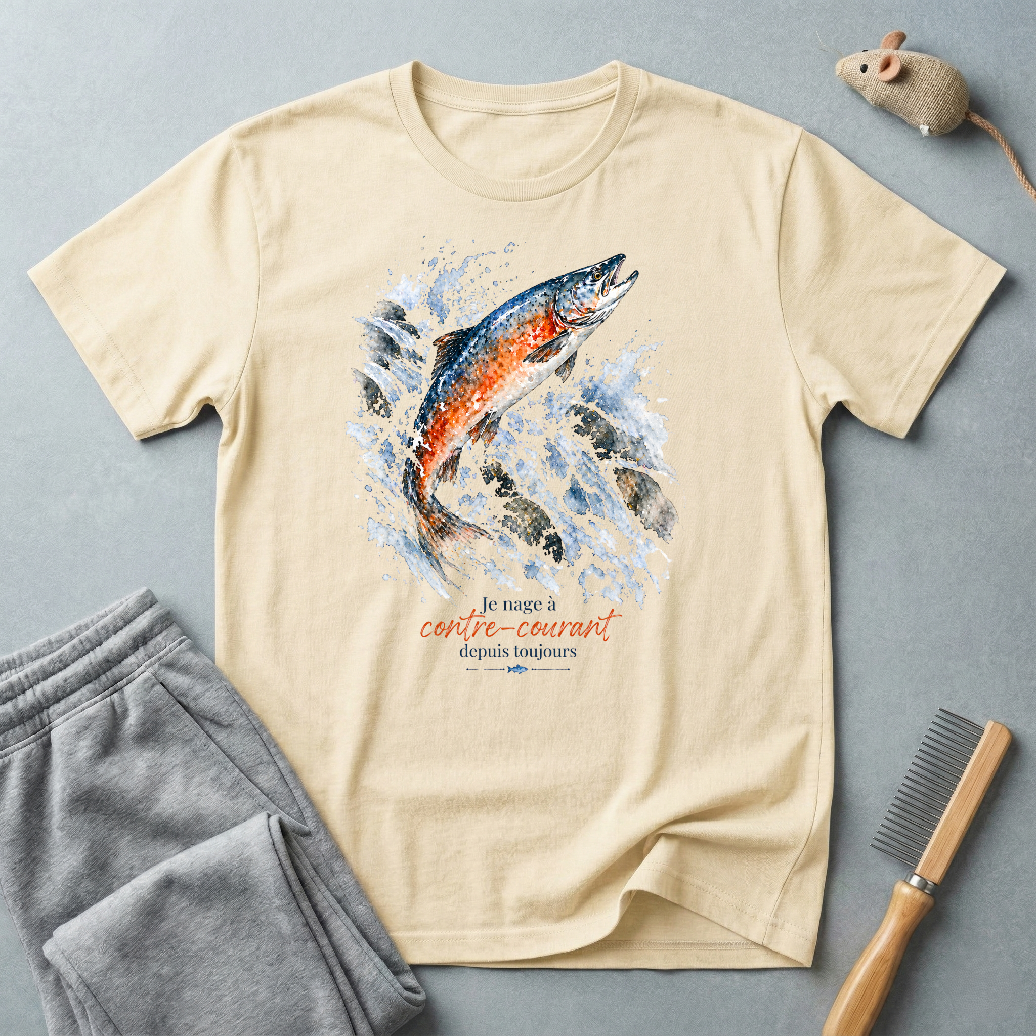 T-shirt graphique saumon bondissant — "Je nage à contre-courant depuis toujours."