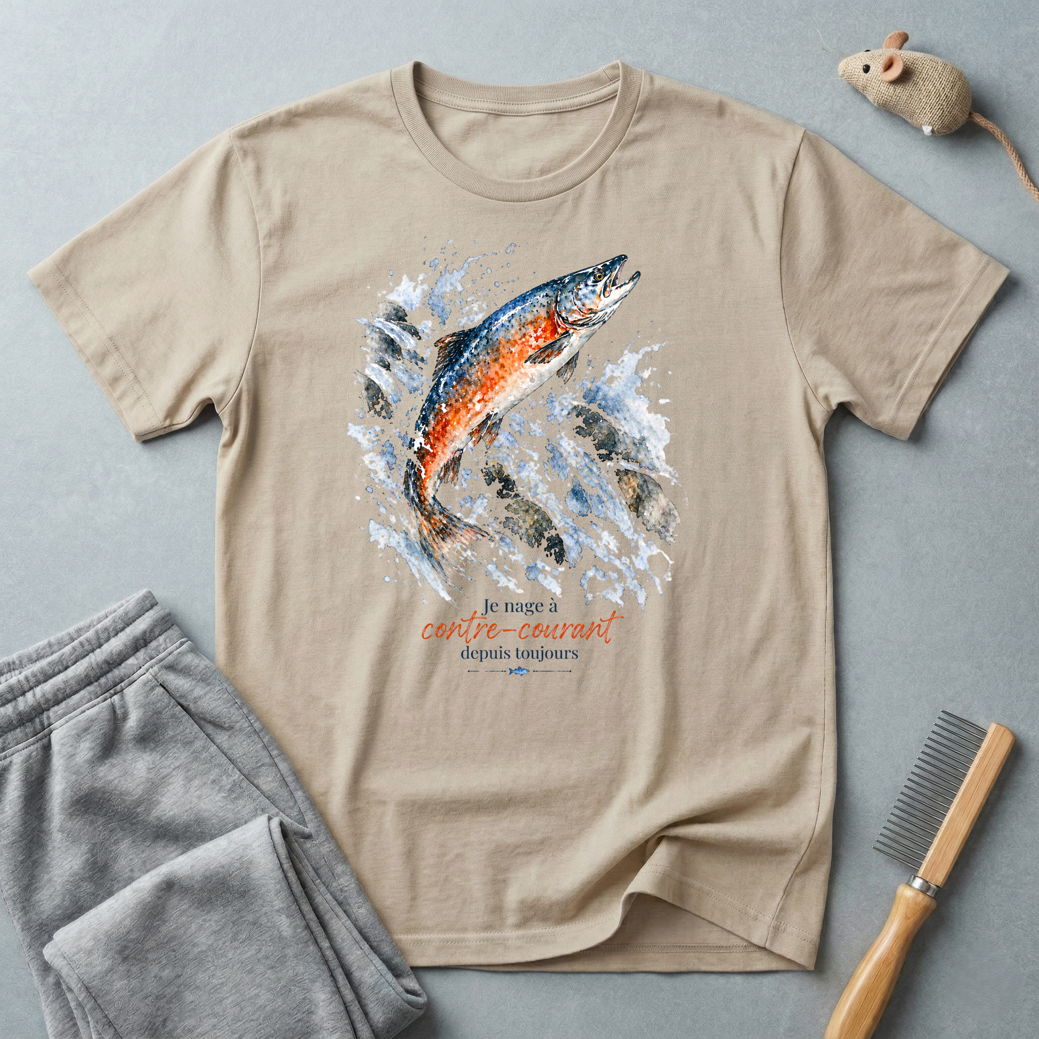 T-shirt graphique saumon bondissant — "Je nage à contre-courant depuis toujours."