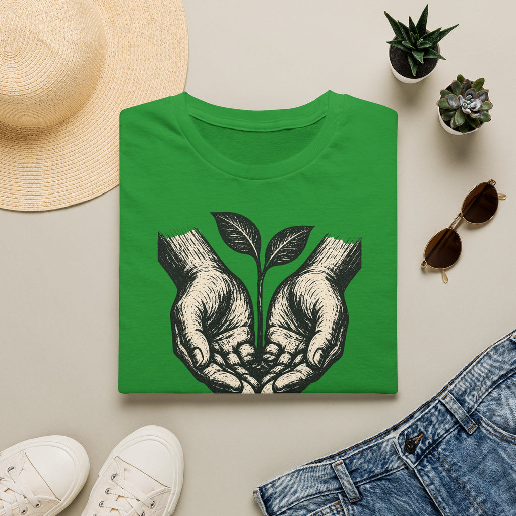 T-shirt — « Entre de bonnes mains » — Illustration graphique de mains tenant une jeune pousse